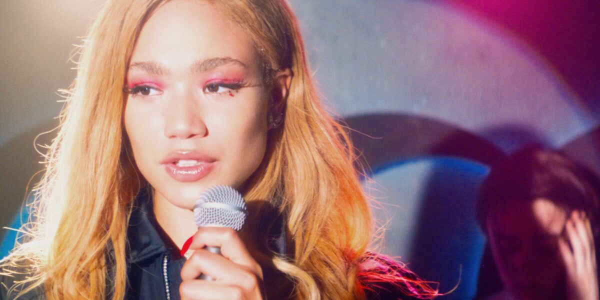 Queer Pop-Infused Music Dramedy Is An Enjoyable Hot Mess That’s Nice To Look At, But Tonally Confusing